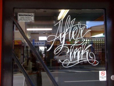 White vinyl die cut window sticker saying after ink