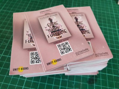 stack of pink rectangular promotional stickers for Chloe Gong book launch