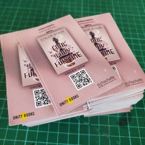 stack of pink rectangular promotional stickers for Chloe Gong book launch