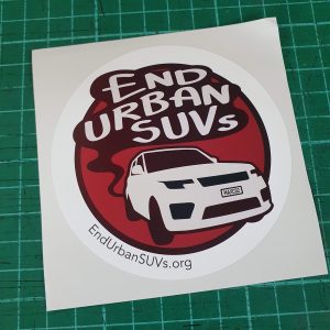 Circle stickers saying End Urban SUVs